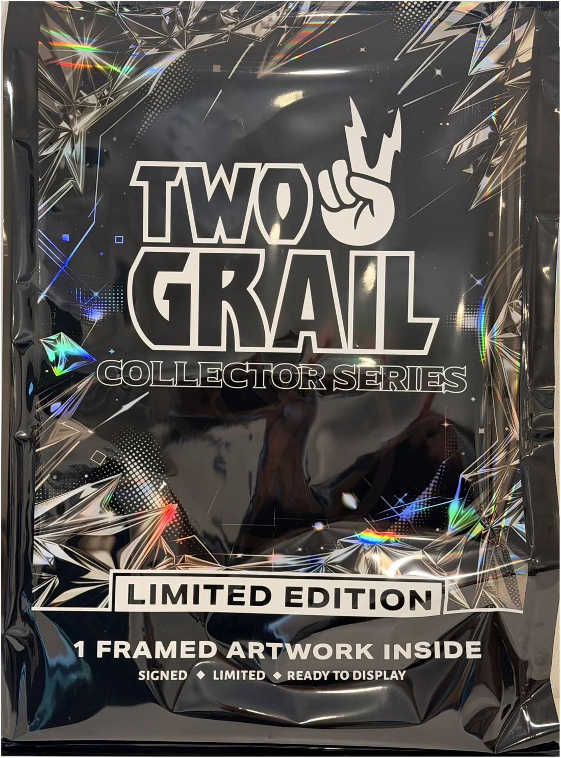 The Two Grail Collector Series pack — one framed artwork inside, signed, limited, ready to display